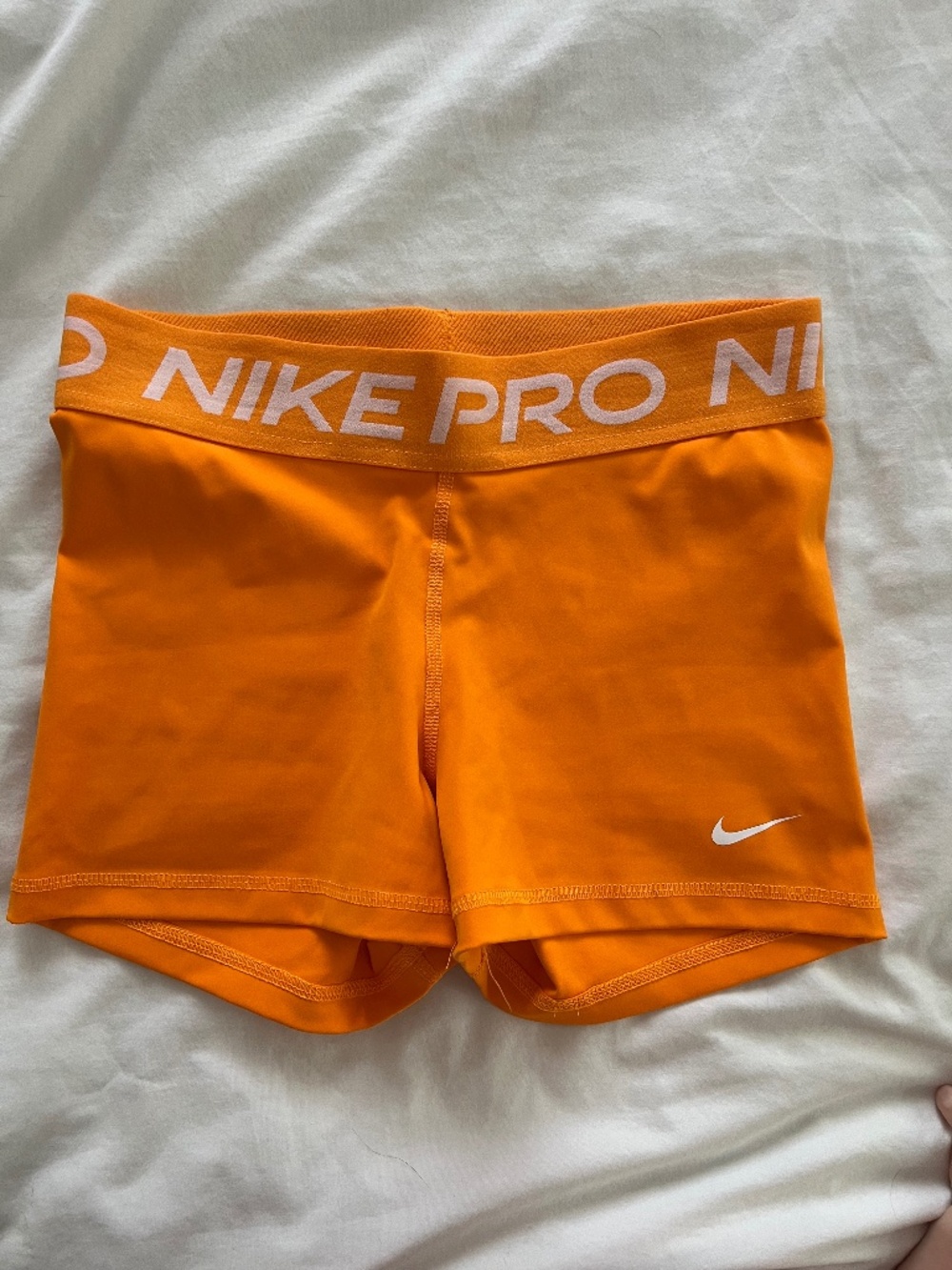 Orange Nike Pro shorts